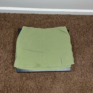 Short green skort. Small slit.